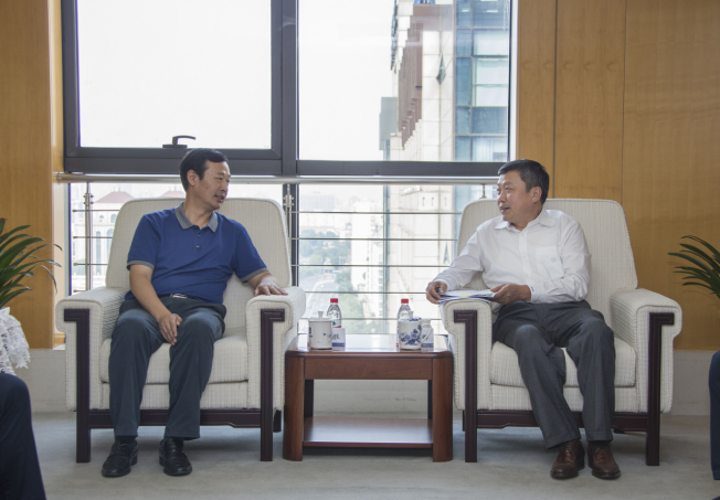 周立群监事长会见中国信保定点扶贫县安徽霍邱县县委书记刘胜